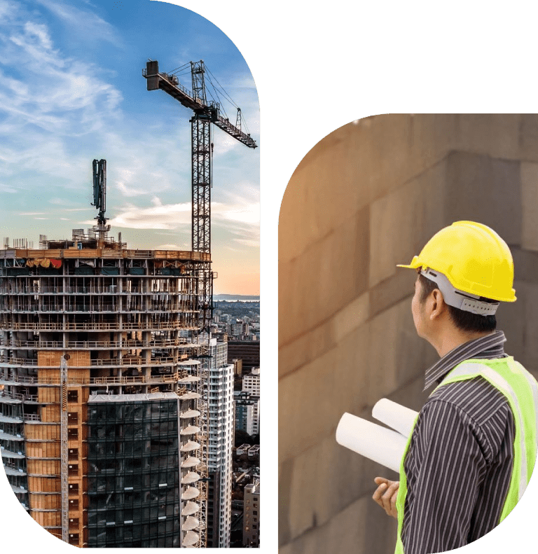 Construction worker inspecting a high-rise building site with cranes.