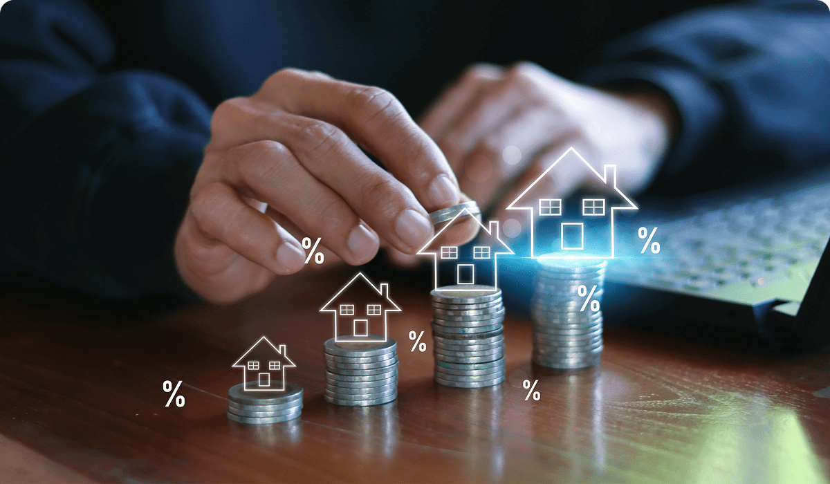 Stacks of coins with house and percentage icons.